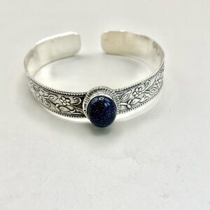 Elegant Sterling Silver Bracelet with a Blue Goldstone Focal Stone